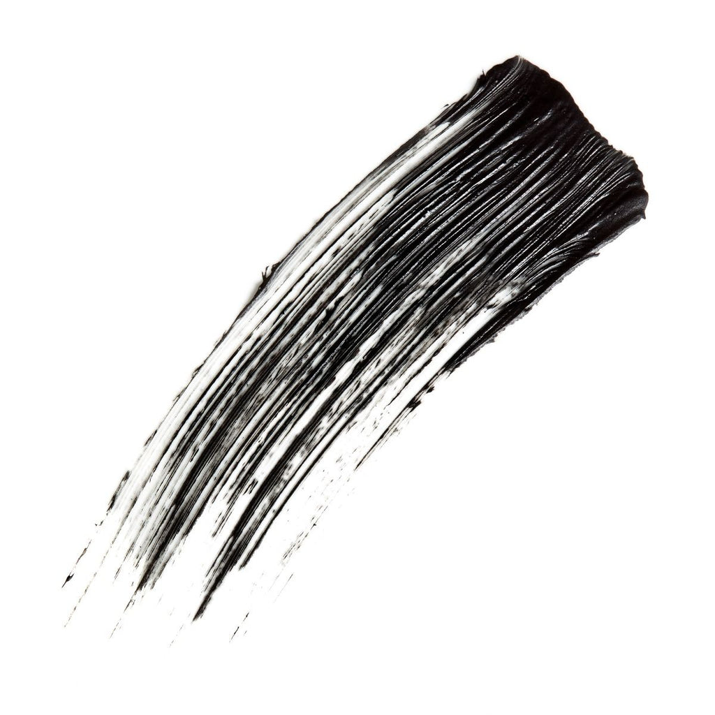 A black mascara brush stroke on a white background.