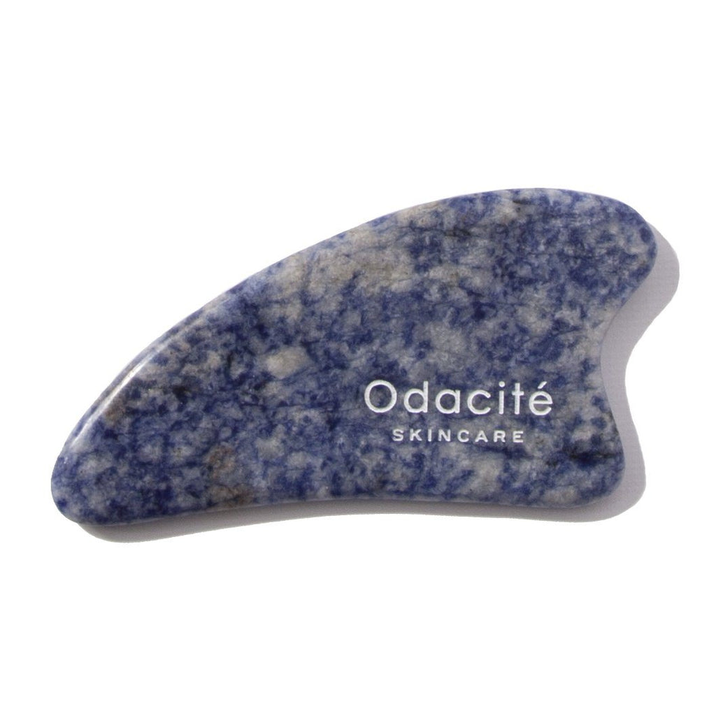 Blue sodalite facial massage tool by odacite skincare.