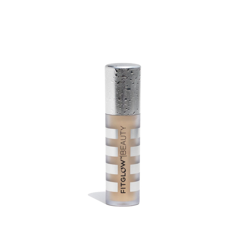 A single tube of fenty beauty foundation with a silver cap, isolated on a white background.