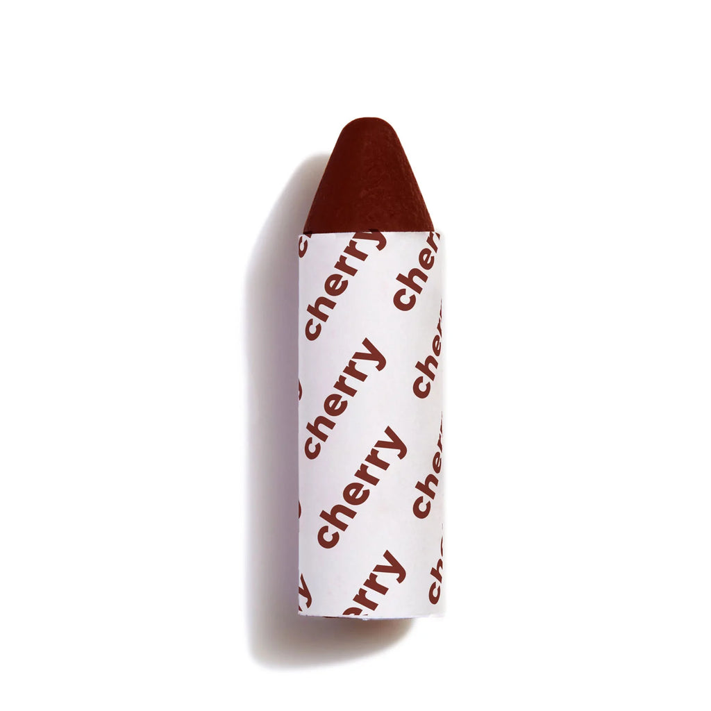 A single cherry-flavored candy with white and red wrapper on a white background.