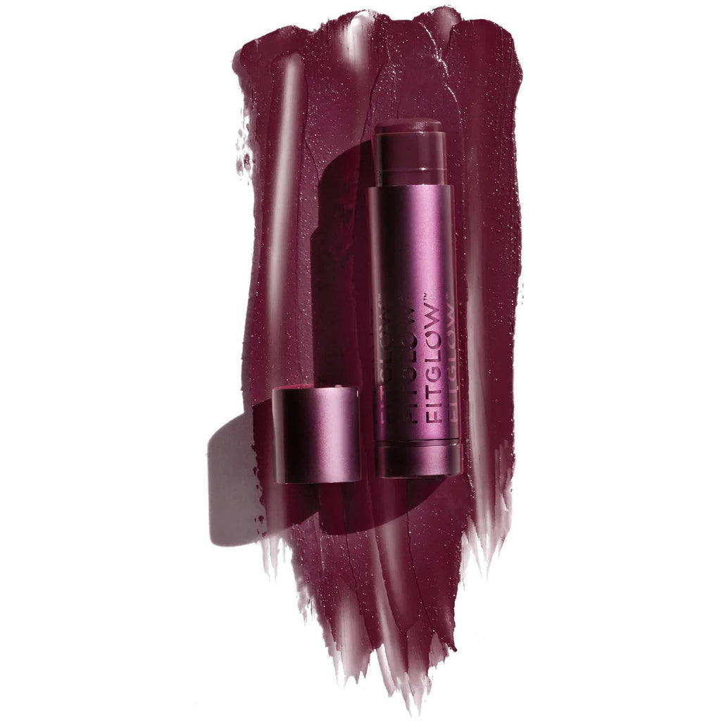 Product display of a burgundy lipstick with creamy texture swatches.