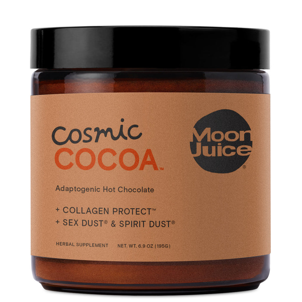 Jar of 'cosmic cocoa' adaptogenic hot chocolate by moon juice with added collagen and herbal supplements.
