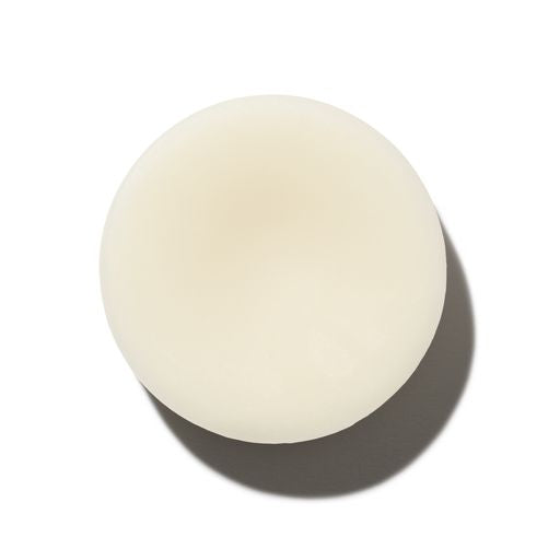 A single egg with a prominent shadow, centered on a plain background.