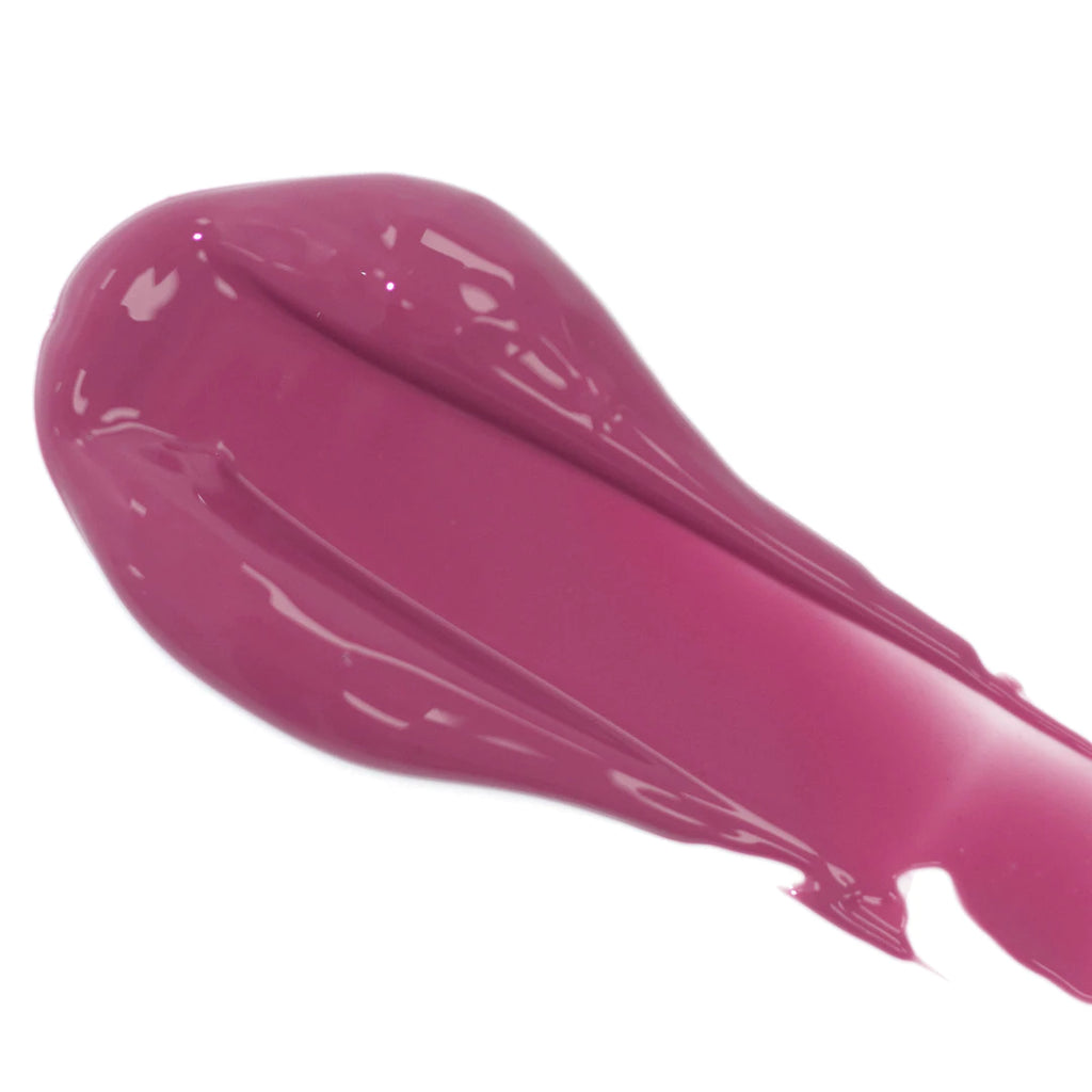 A smear of glossy pink lipstick.