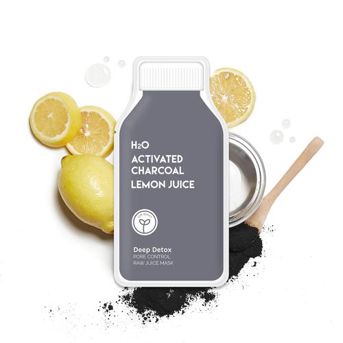 Activated charcoal lemon juice facial mask product with lemon slices and black powder.