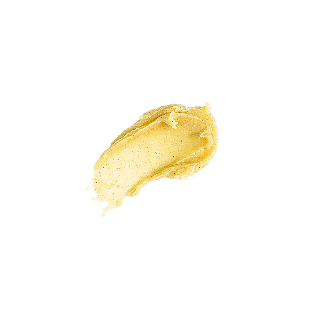 A smear of creamy peanut butter isolated on a white background.