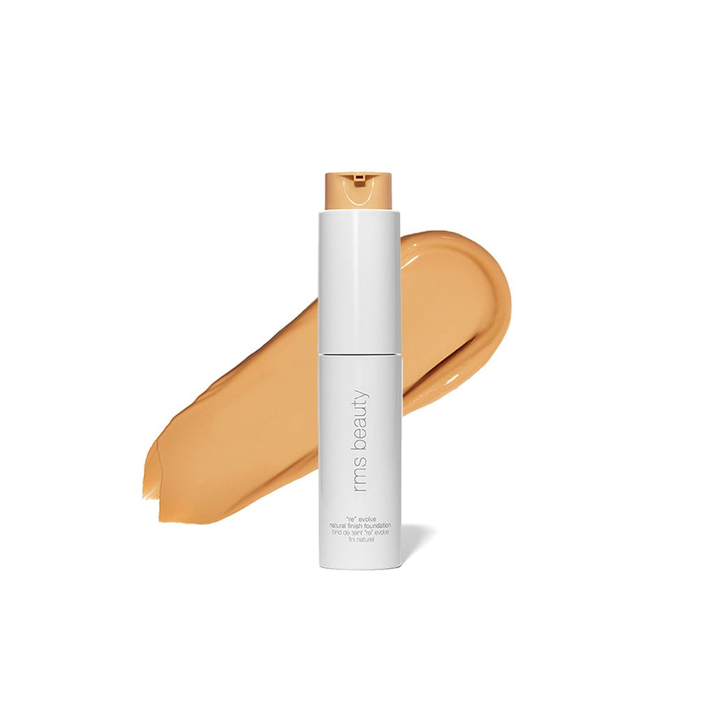 Foundation bottle with a swatch of liquid makeup displayed on a white background.