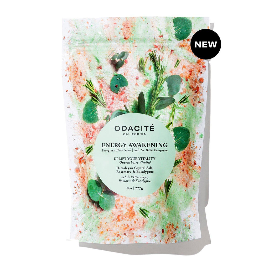A new package of odacite california energy awakening bath soak with botanical elements and splashes of color on the design.