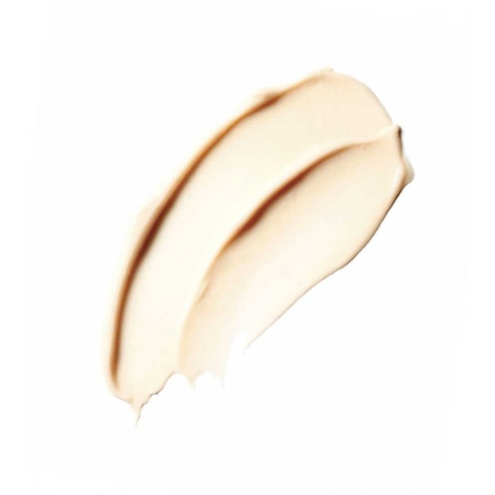 A smudge of liquid foundation makeup on a white background.
