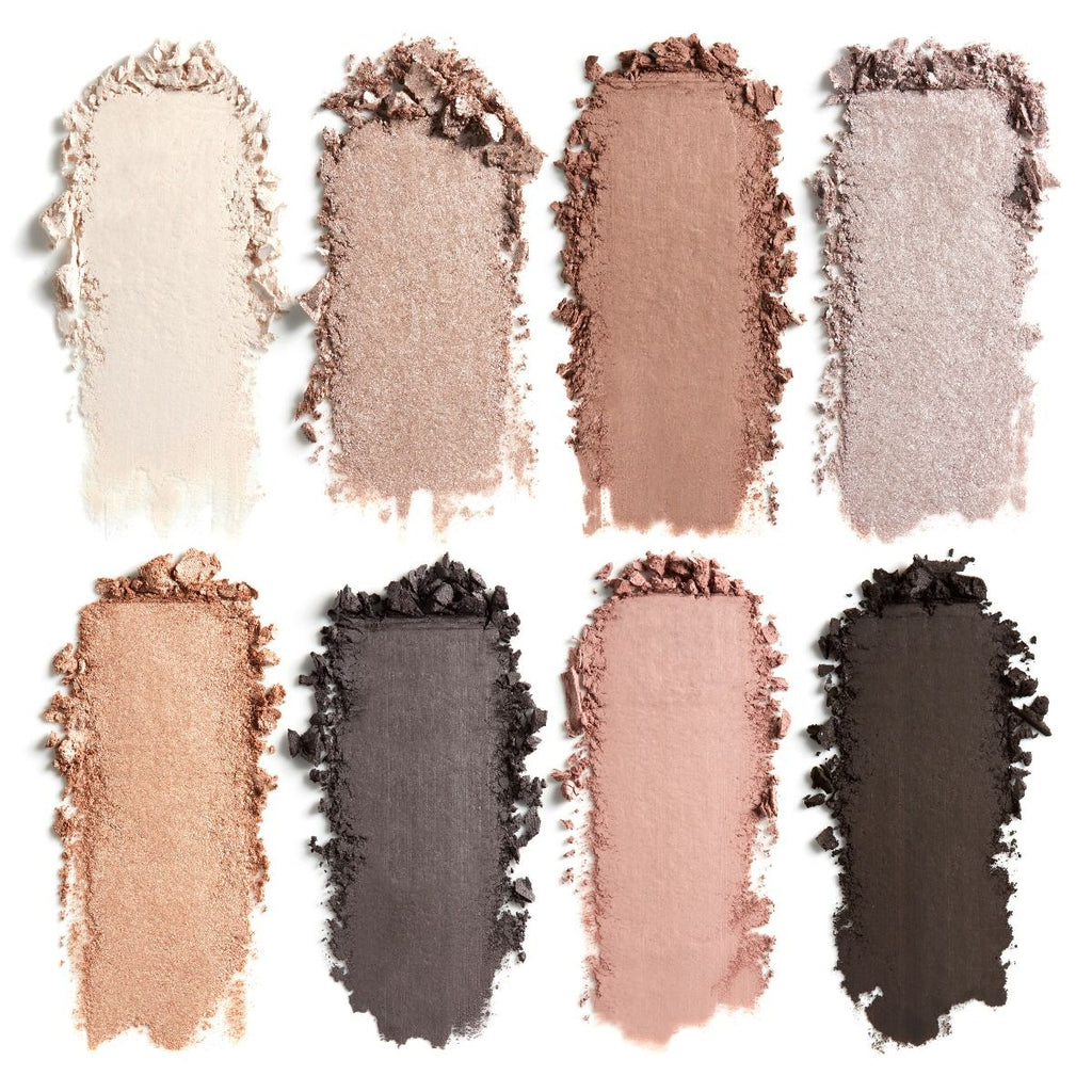 A palette of neutral eyeshadow swatches with varying shades from light cream to dark brown.