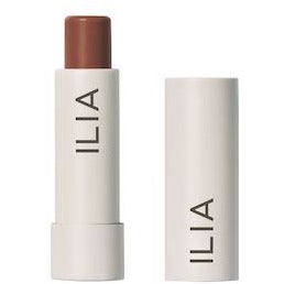 Ilia brand lipstick with cap removed, displaying the product color.
