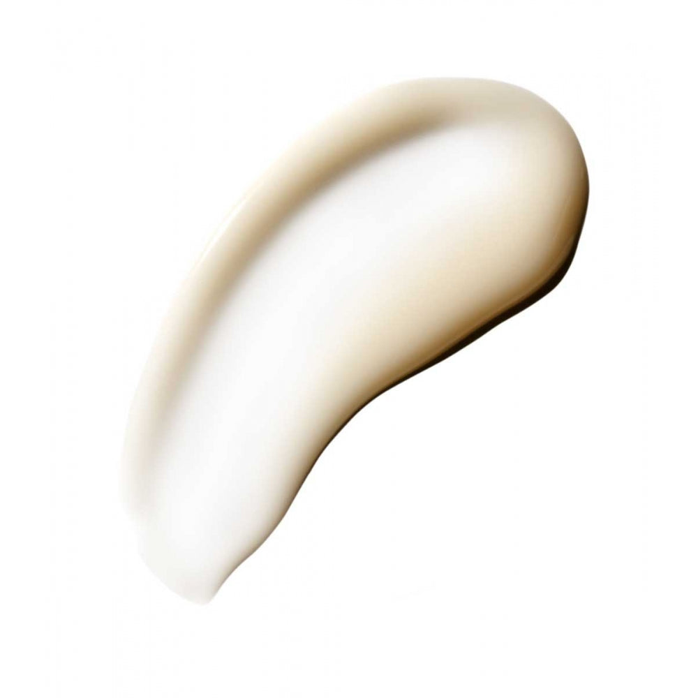 A smear of creamy white substance, possibly lotion or foundation, against a white background.