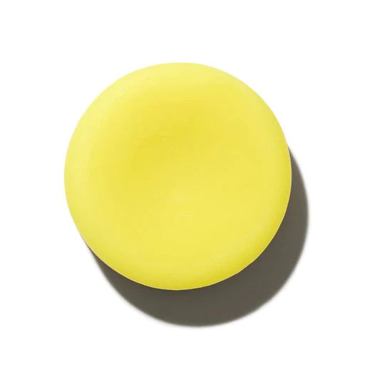 A plain yellow ball on a white background with a shadow underneath.