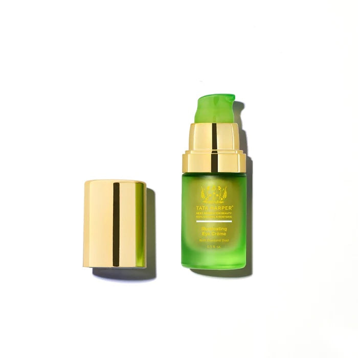An isolated product image of tata harper clarifying cleanser with its cap placed beside it on a white background.
