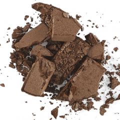Crumbled pieces of chocolate bar scattered on a white background.