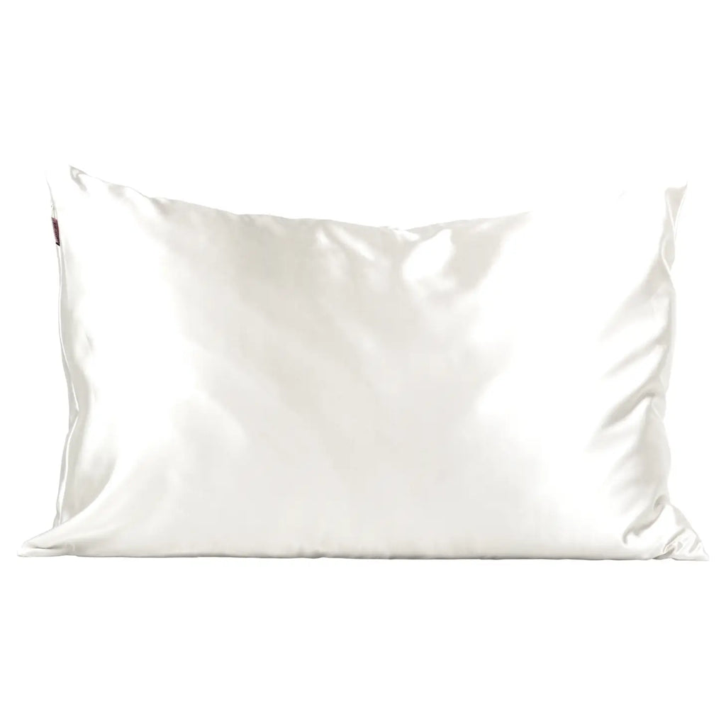 A plain white pillow on a white background.