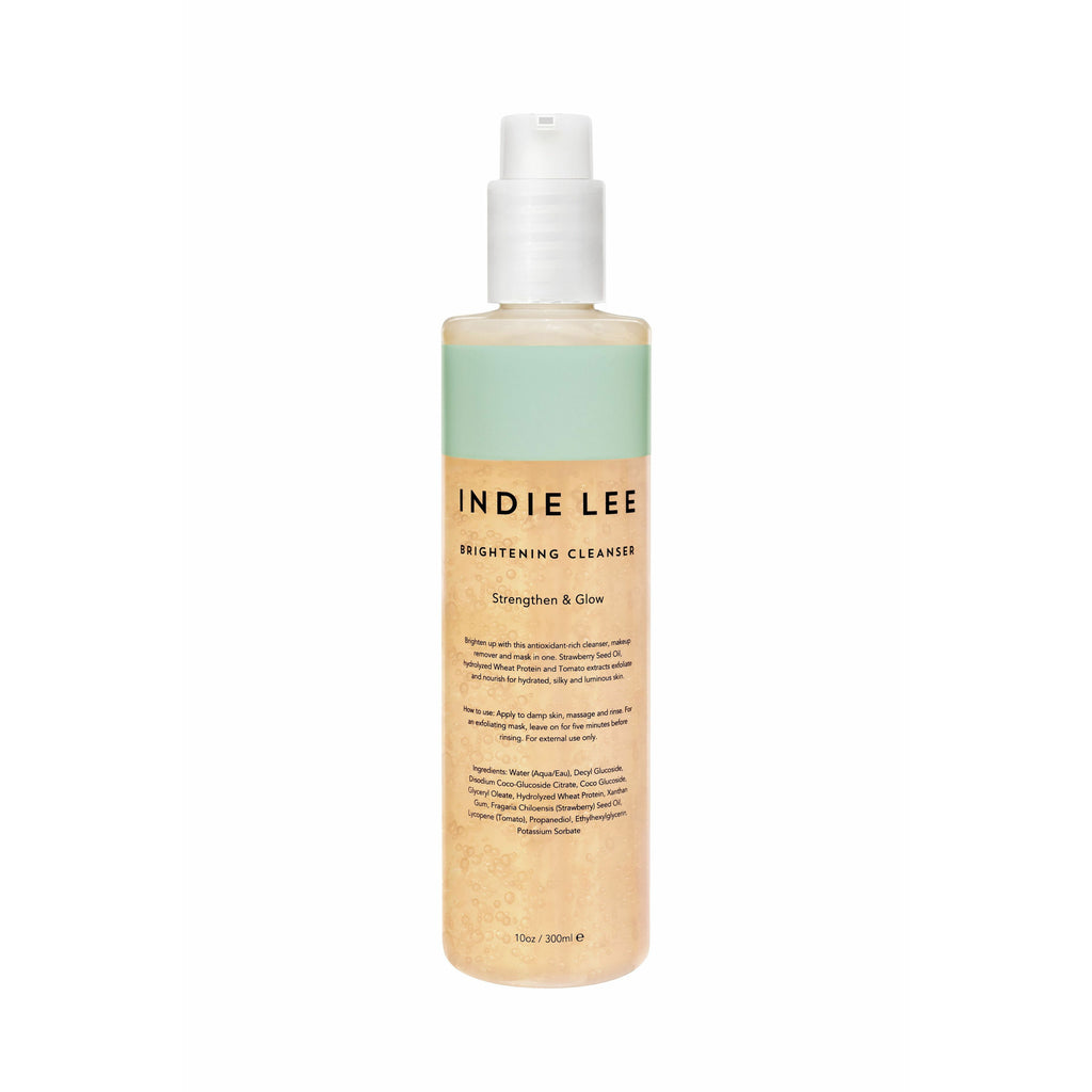 Bottle of indie lee brightening cleanser with pump dispenser.