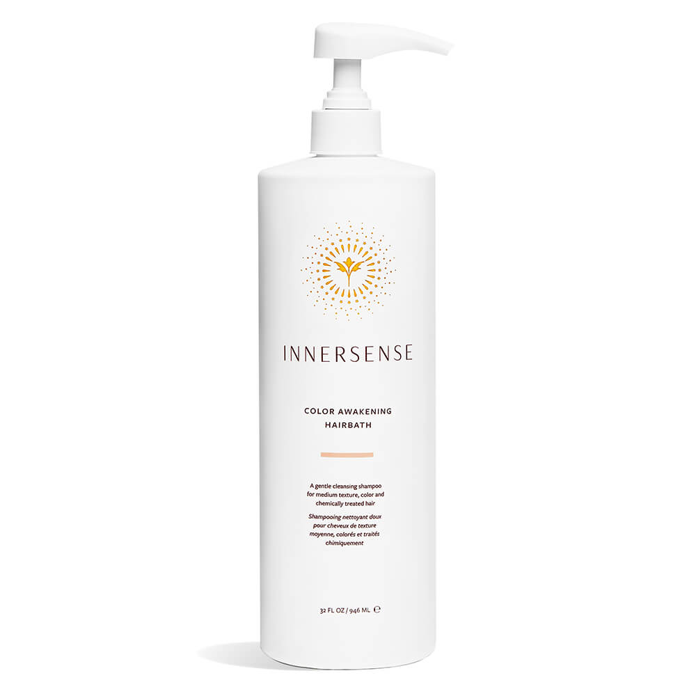 Bottle of innersense color awakening hairbath shampoo on a white background.