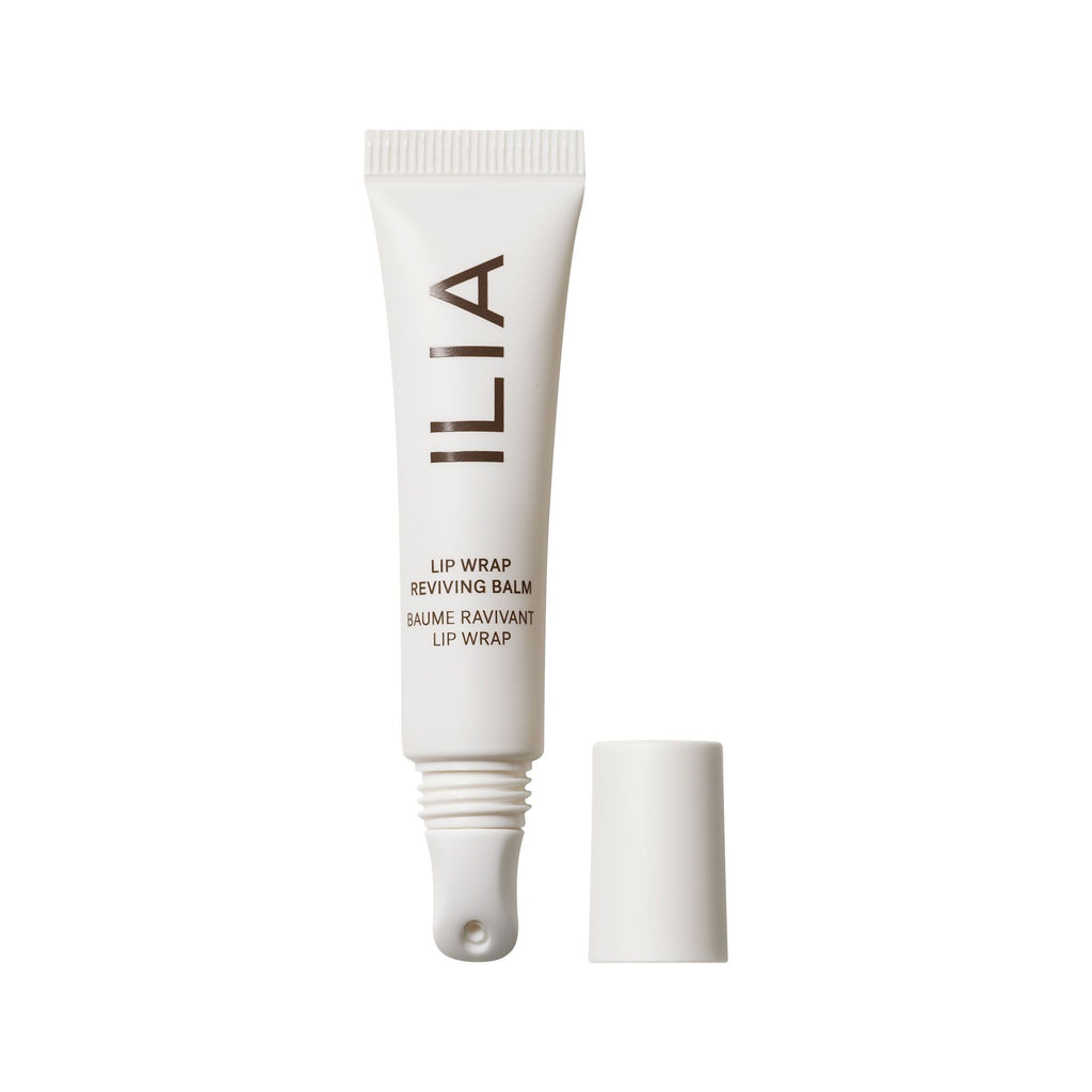 A tube of ilia lip wrap reviving balm with its cap off.