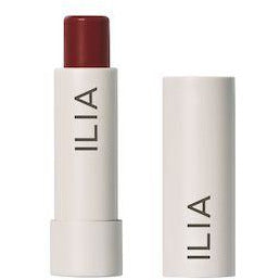 Red lipstick with a white and silver case, labeled "ilia.