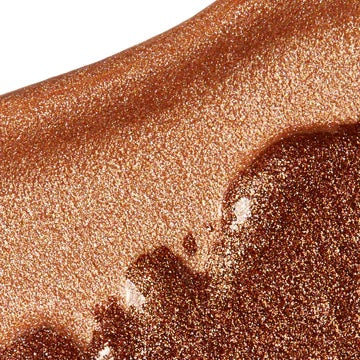 Bronze shimmering powder texture close-up.