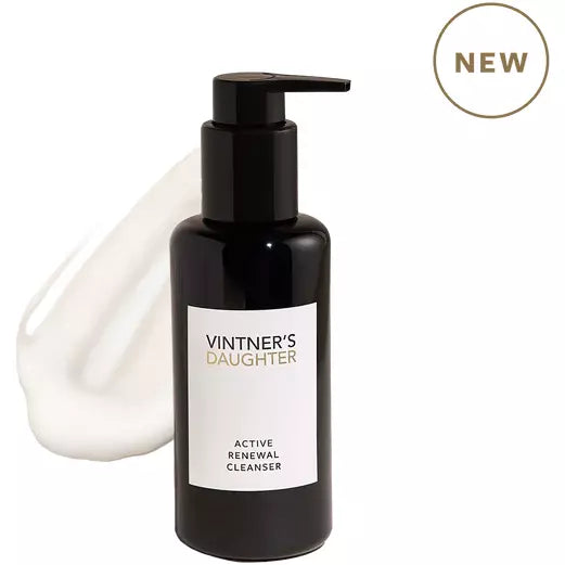A new bottle of vintner's daughter active renewal cleanser with a pump dispenser and a swatch of the product beside it.