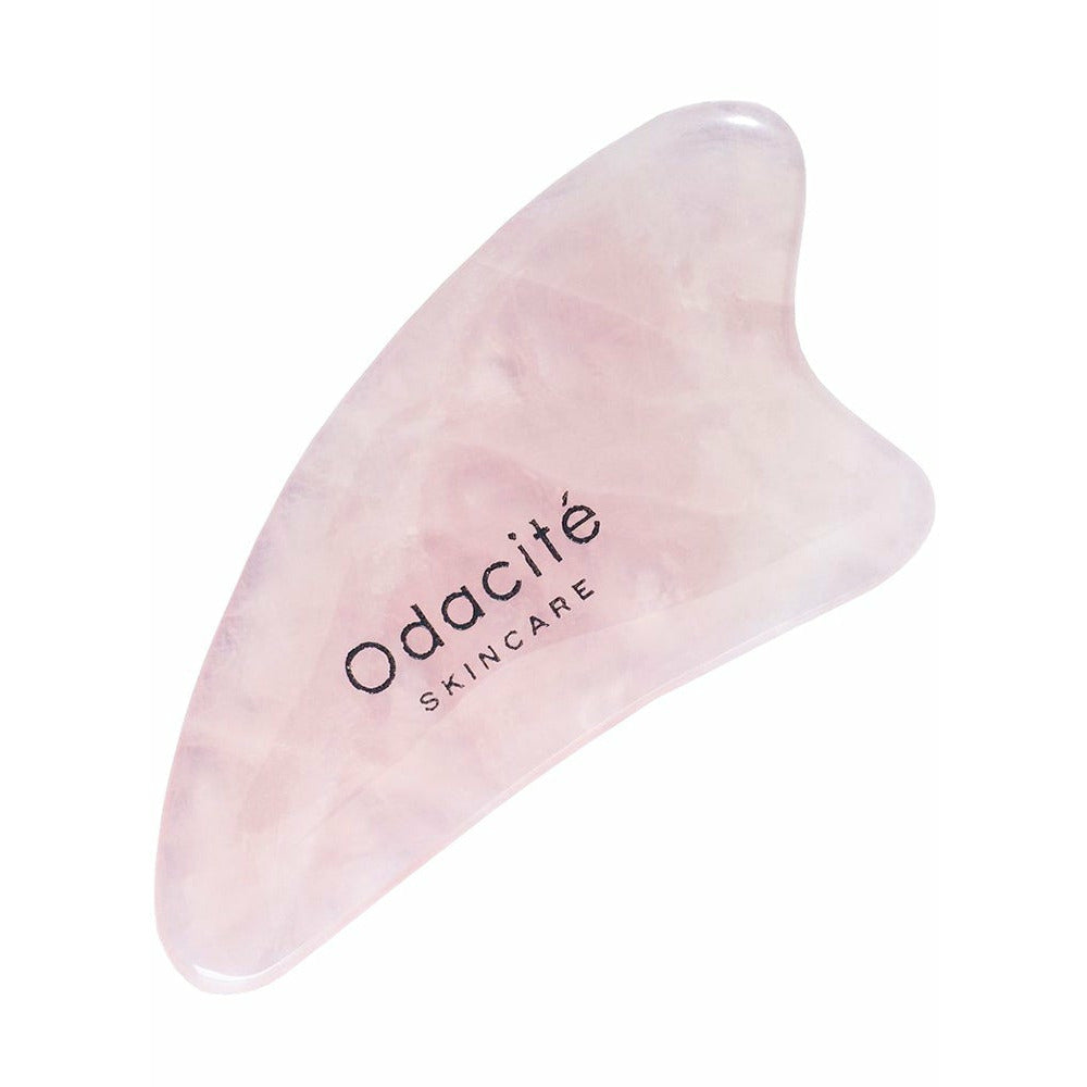 A rose quartz facial sculpting tool by odacite skincare.