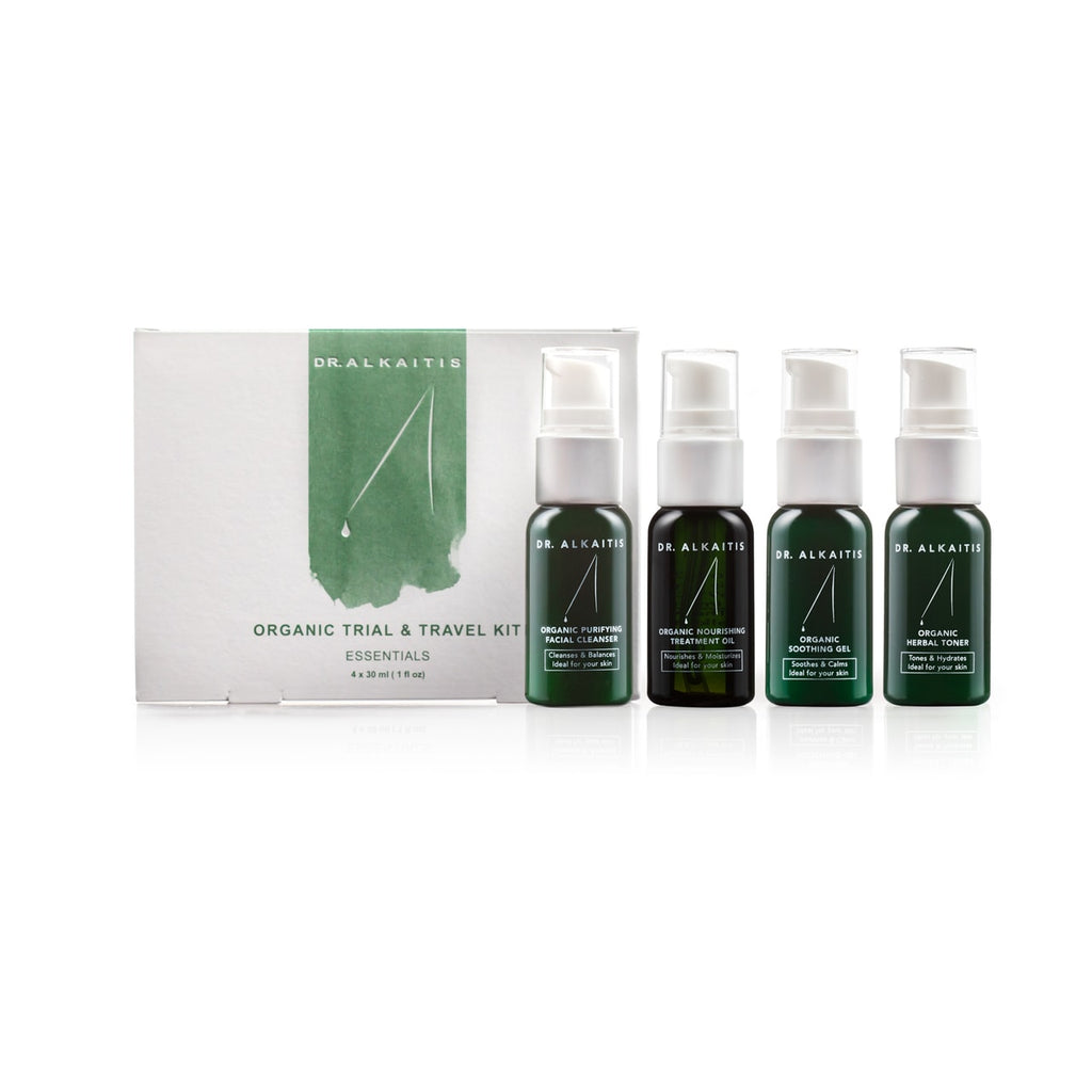 A set of four organic skincare products by dr. alkaitis, including a trial and travel kit packaging.