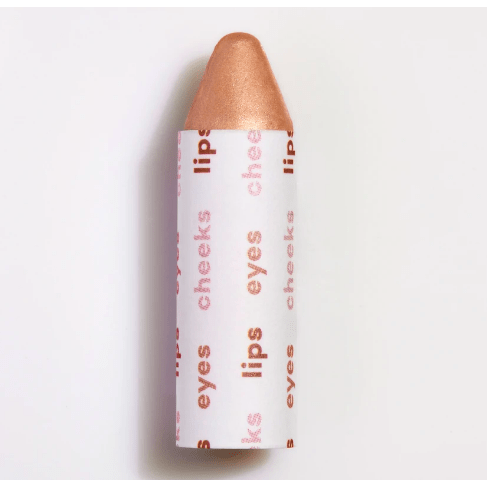A close-up of a multi-use makeup stick against a white background.