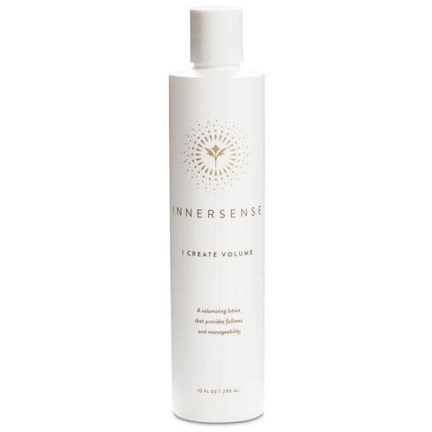 A bottle of innersense "i create volume" hair lotion on a white background.