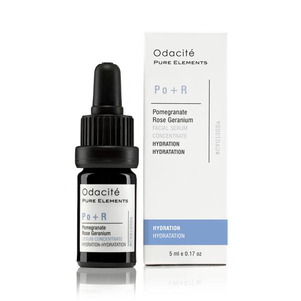 A bottle of odacite po+r pomegranate rose geranium facial serum concentrate beside its packaging.