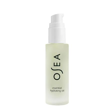 A pump bottle of osea essential hydrating oil on a white background.
