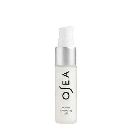 A bottle of osea ocean cleansing milk skincare product on a white background.