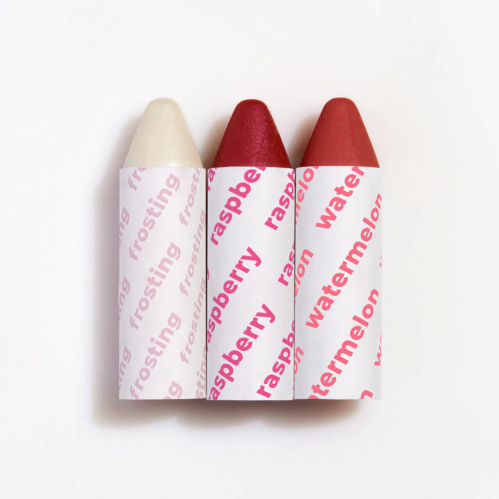 Three lipsticks with varying shades from light to dark displayed in a row against a white background.
