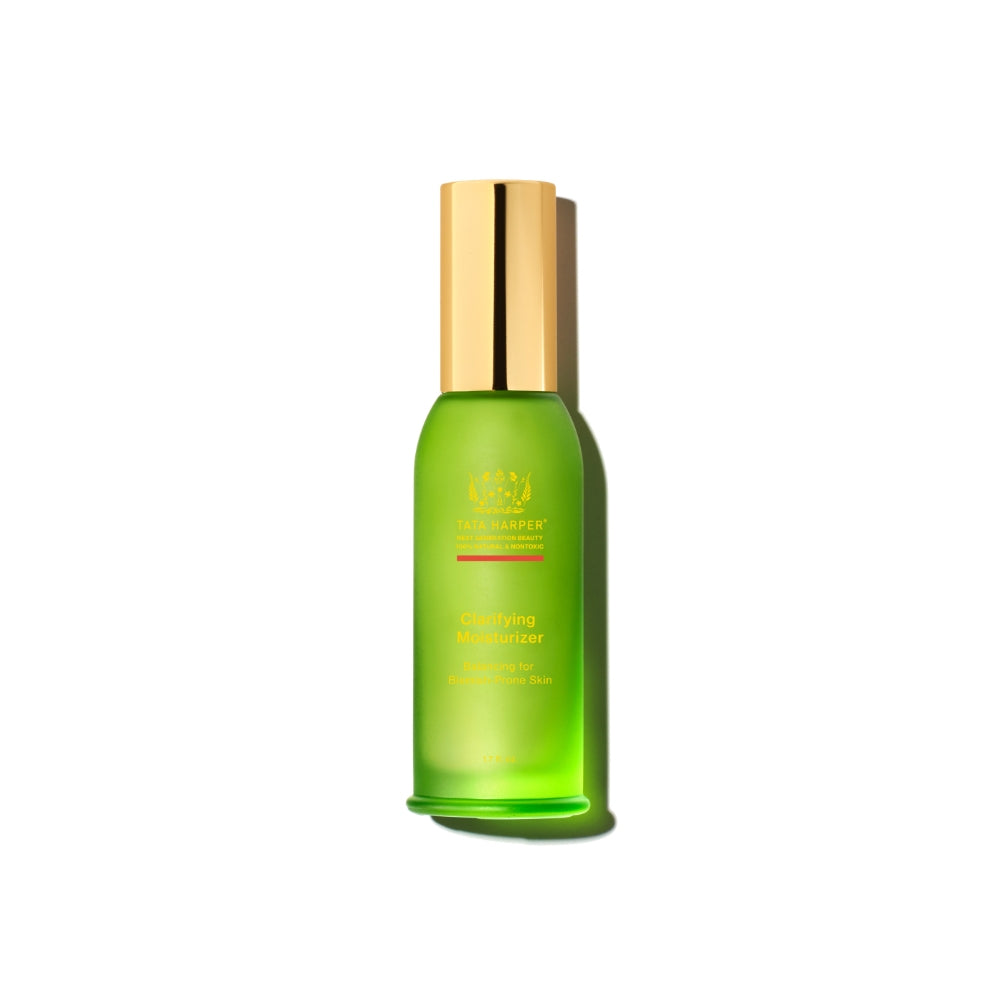Green bottle of tata harper clarifying moisturizer on a white background.
