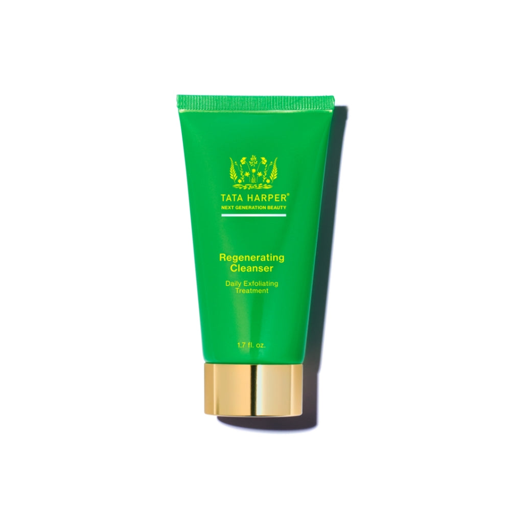 Green and gold tube of tata harper regenerating cleanser on a white background.