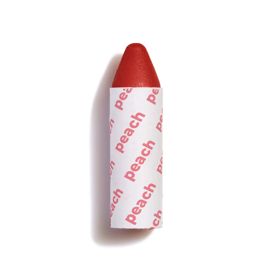Red crayon with the word "peach" printed on its wrapper.