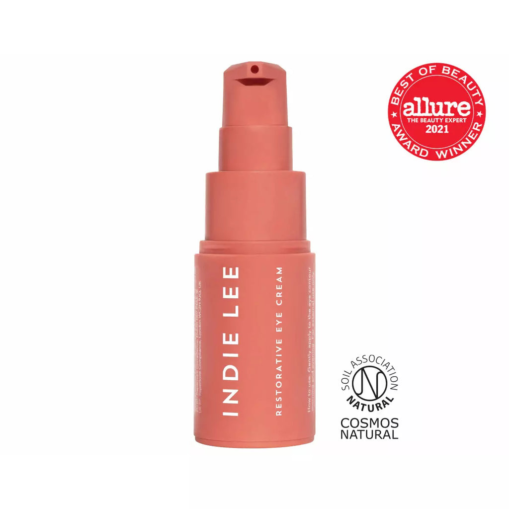 Product image of indie lee restorative eye cream packaging with allure best of beauty and cosmos natural certification logos.