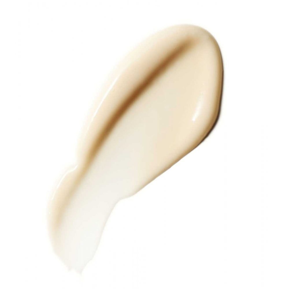 Smear of liquid foundation makeup on a white background.