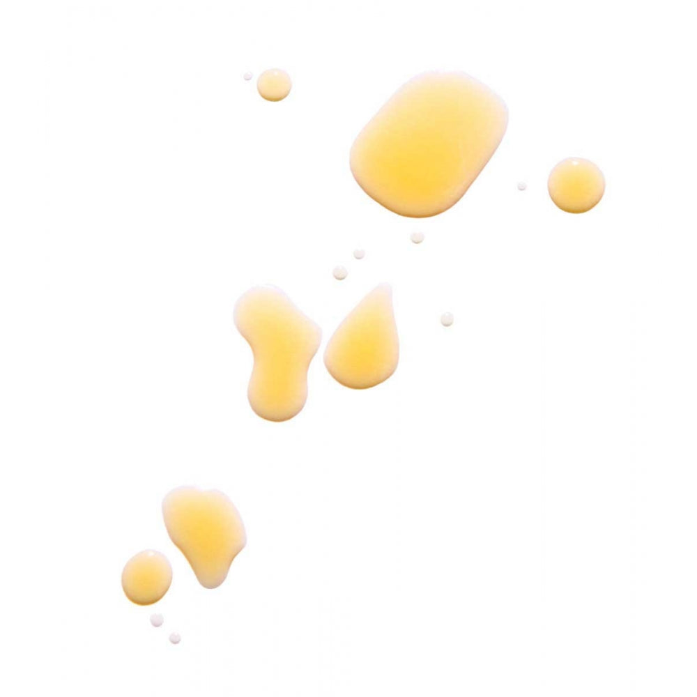 Drops of yellow liquid scattered on a white background.