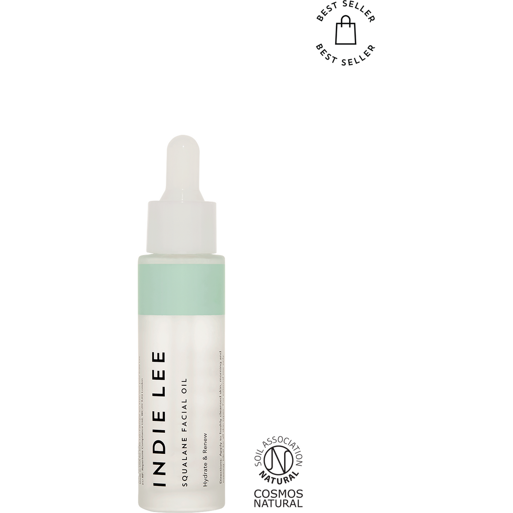 Bottle of indie lee squalane facial oil with a dropper, labeled as a best seller and certified natural by cosmos.