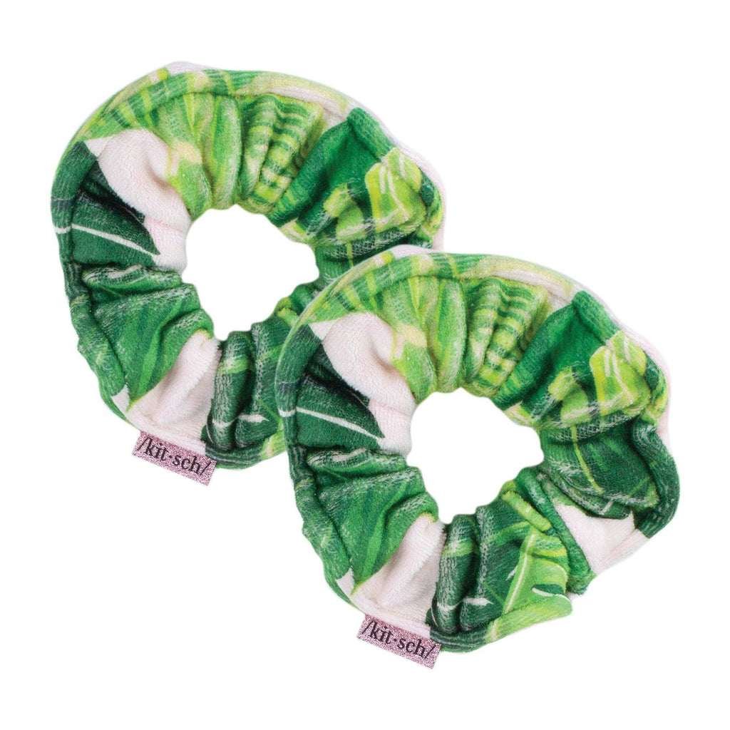 Two green and white floral patterned scrunchies.