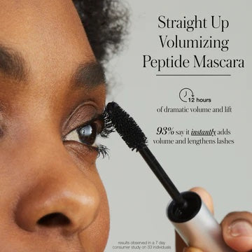 Applying volumizing peptide mascara to enhance lash volume and length.