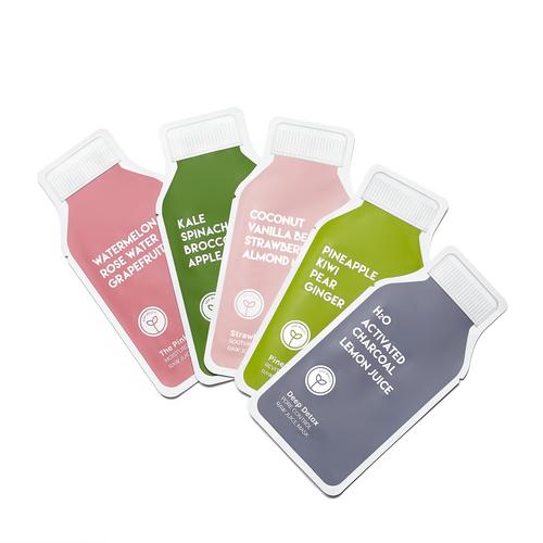 Five assorted colorful juice bottles with fruit and vegetable flavor labels displayed on a white background.