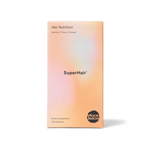 A box of "superhair" dietary supplement by moon juice containing 120 capsules for hair nutrition.