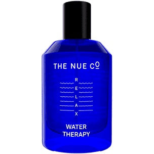 A blue bottle of "the nue co. water therapy" fragrance.
