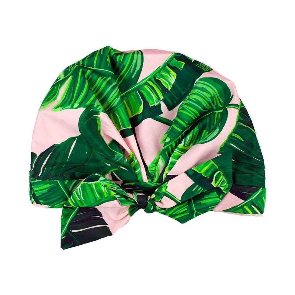 Pink turban with green leaf pattern isolated on a white background.
