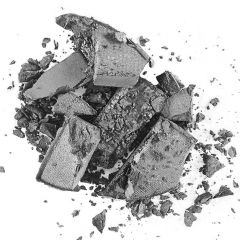 Pieces of broken chocolate bar scattered on a surface.