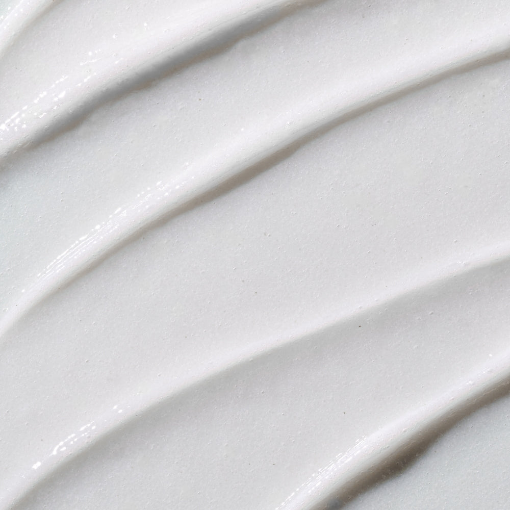 Close-up of white textured surface with wavy lines.
