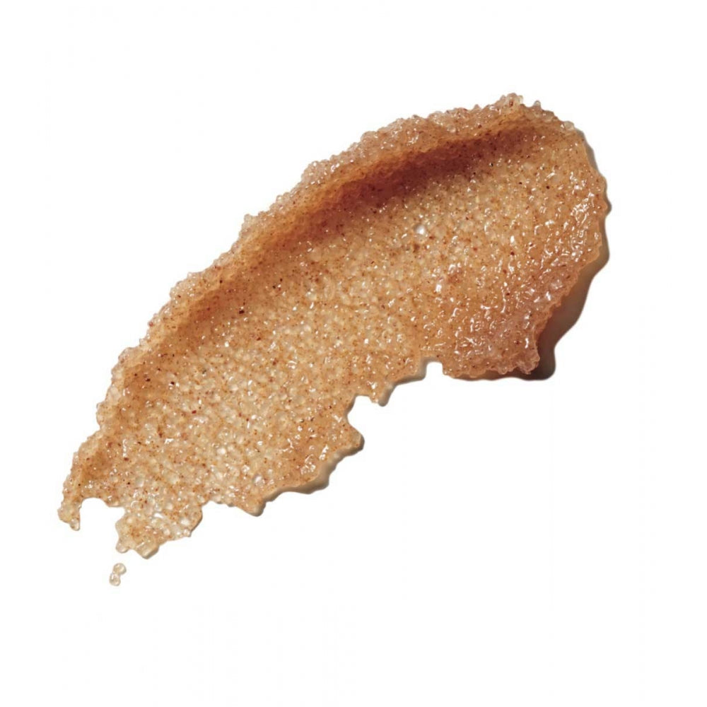 A smear of brown sugar scrub isolated on a white background.